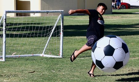 Summer of fun, Second Annual Bash, held recently at Veterans Park for kids and adults An oversized soccer ball was a bit hit.